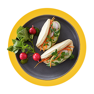 yellow background with plated tacos