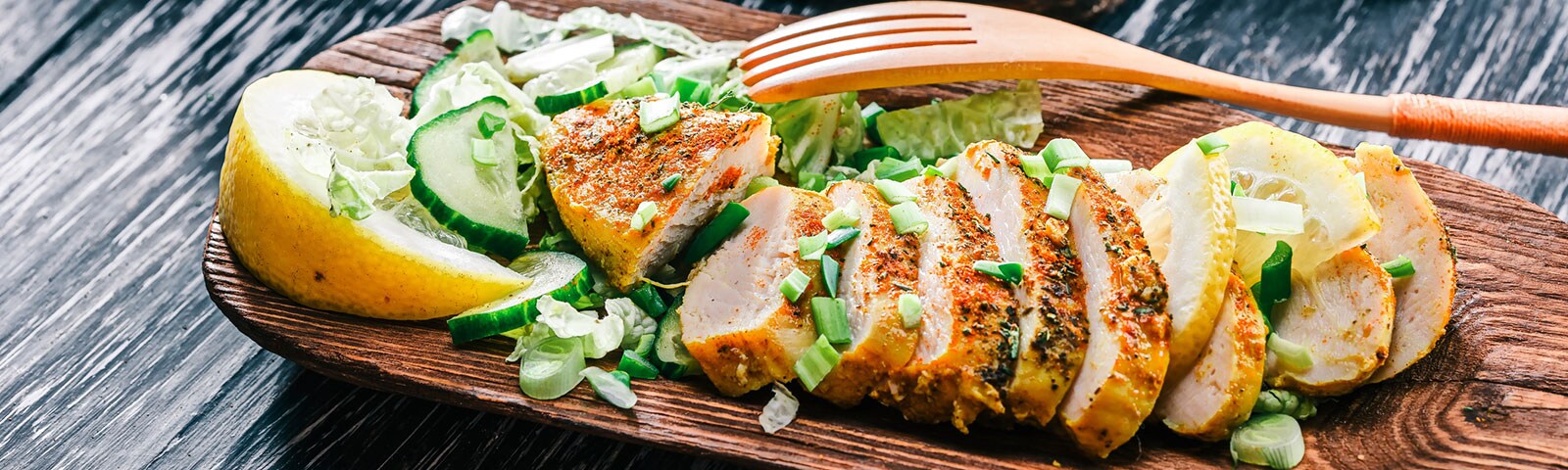 Chicken and vegetable on a wooden platter