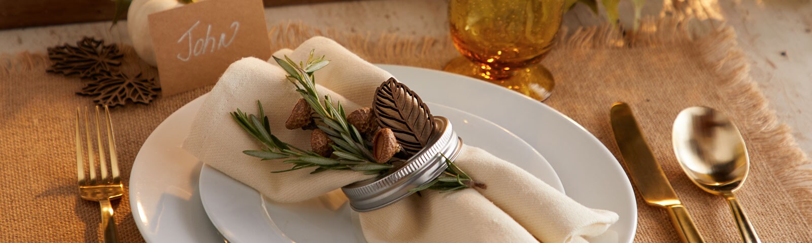 Place setting with cream napkin and gold silverware