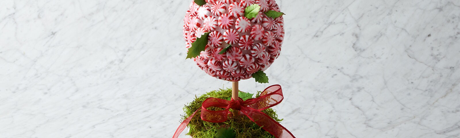Round peppermint candy tree with a red ribbon